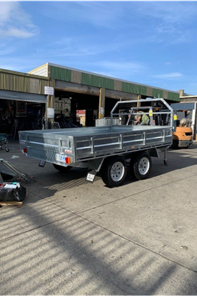 Galvanised tandem box trailer with cage and reinforced chassis built for heavy duty transport in Tasmania